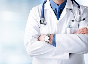 Doctor Man With Stethoscope In Hospital