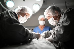 Doctors doing a surgery on operating room in hospital