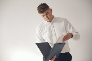 Stylish businessman working in a office and use the phone